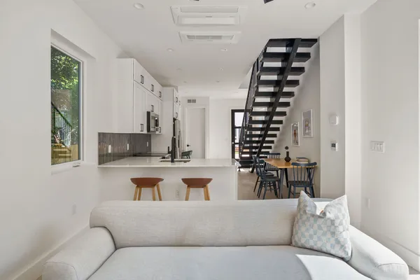a living room with furniture and fireplace