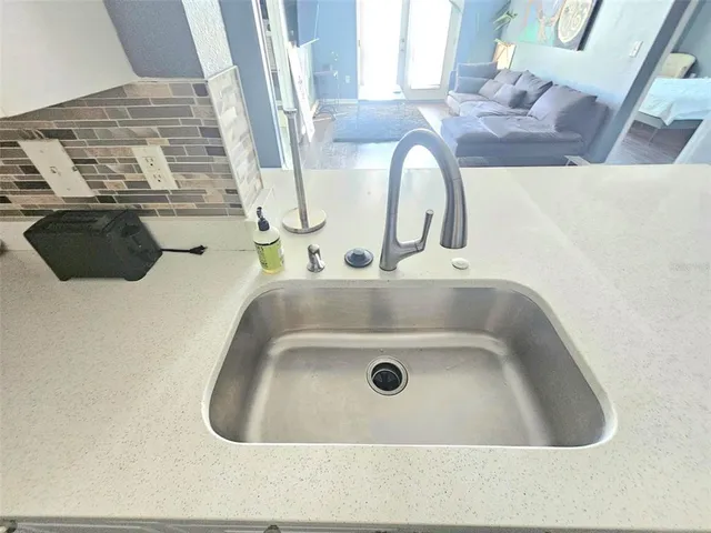 a bedroom with a bed chair and window