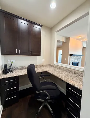 a kitchen with a sink cabinets and window