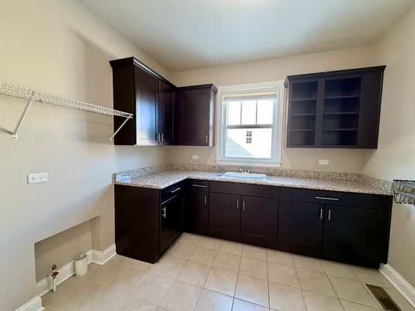 a kitchen with a refrigerator and a sink