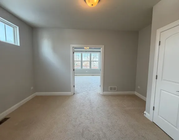 a spacious bathroom with a double vanity sink and a mirror
