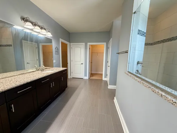 an empty room with large windows and dryer