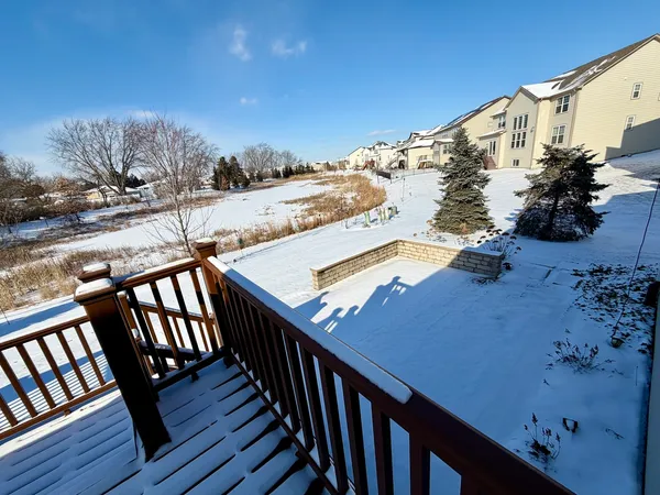 a view of a roof deck with wooden fence