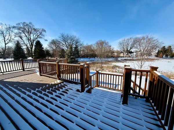a view of a balcony with wooden fence