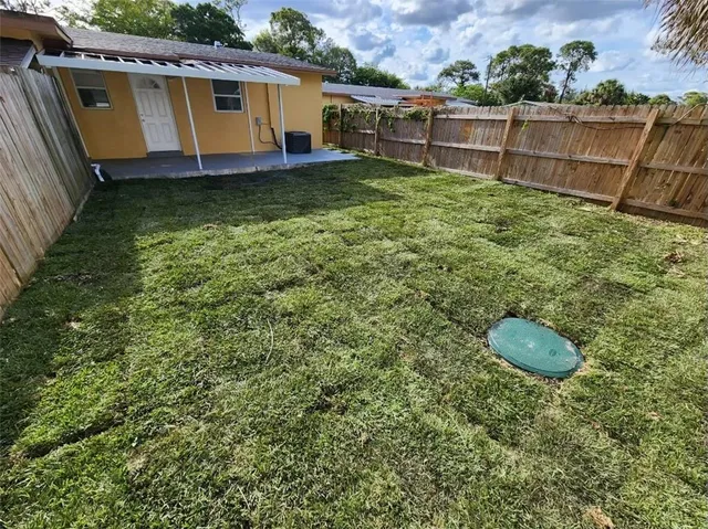 a backyard of a house with lots of green space