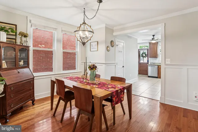 a bedroom with a bed and chandelier