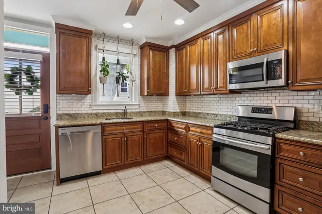 a bathroom with a sink a mirror and a shower curtain