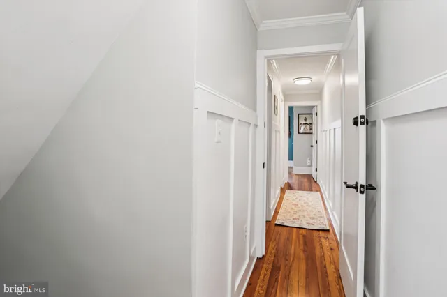 a view of a door and wooden floor