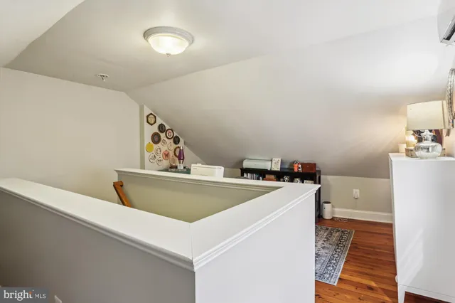 a view of a house with a yard and a pond