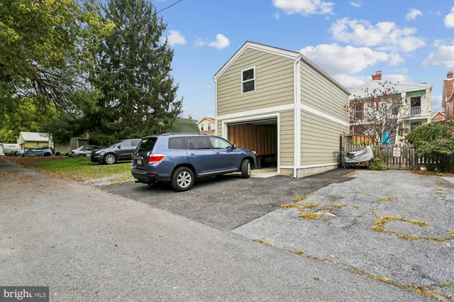 a view of a park that has large trees