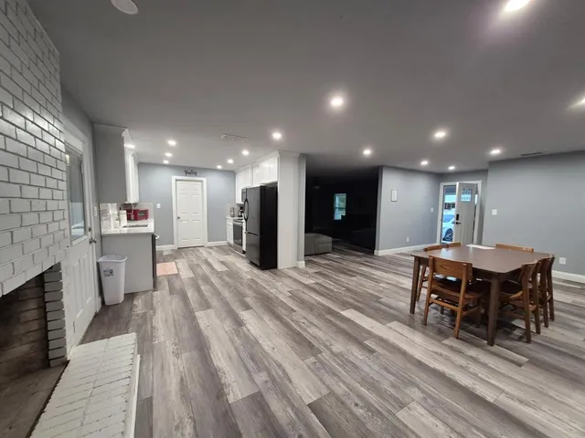 a open kitchen with a table and chairs in it