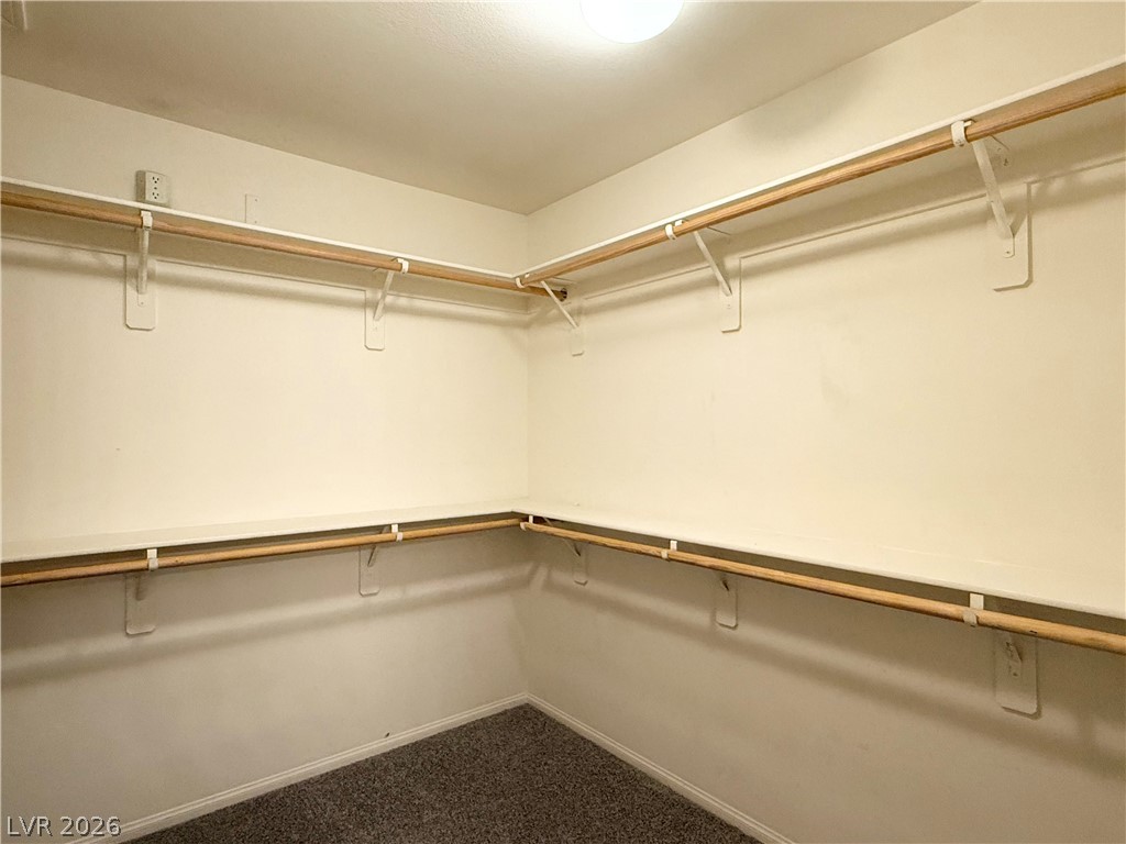 8231 Buffalo Ranch Avenue Las Vegas, NV 89147 - Photo 15 of 22 Ample storage options with dual-level hanging rods and integrated shelving for organization.