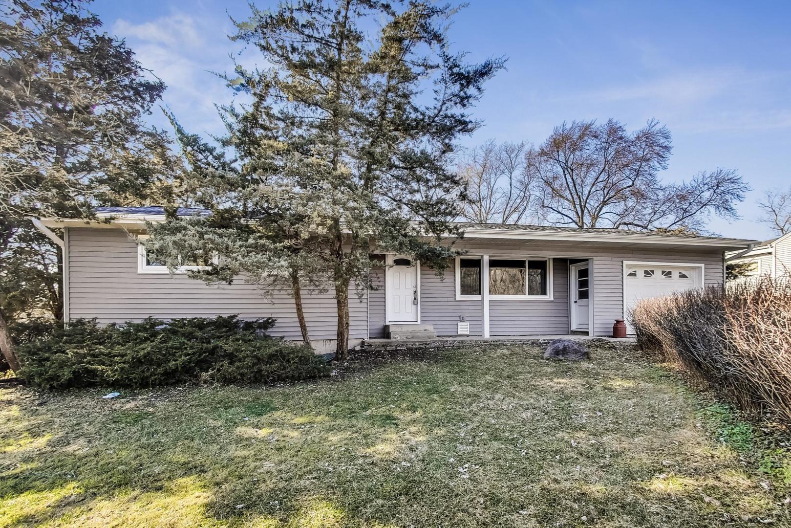 10S462 Ruth Drive Lemont, IL 60439 - Photo 1 of 24 a front view of a house with garden