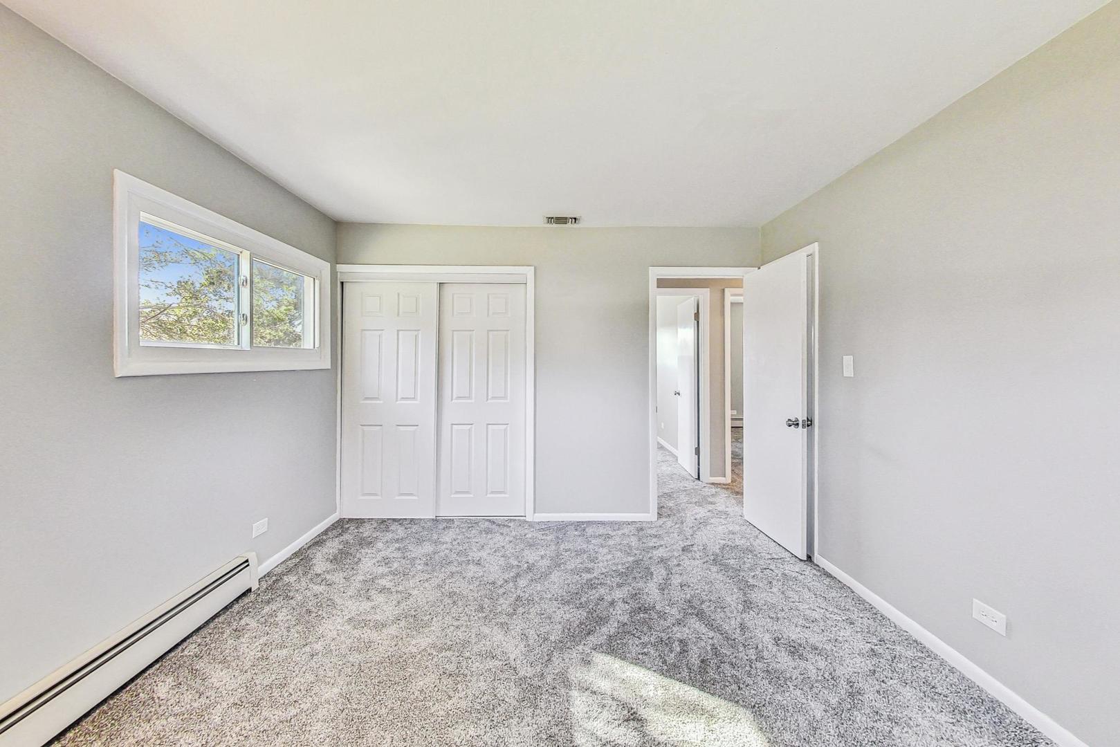 10S462 Ruth Drive Lemont, IL 60439 - Photo 11 of 24 a view of an empty room with window and closet