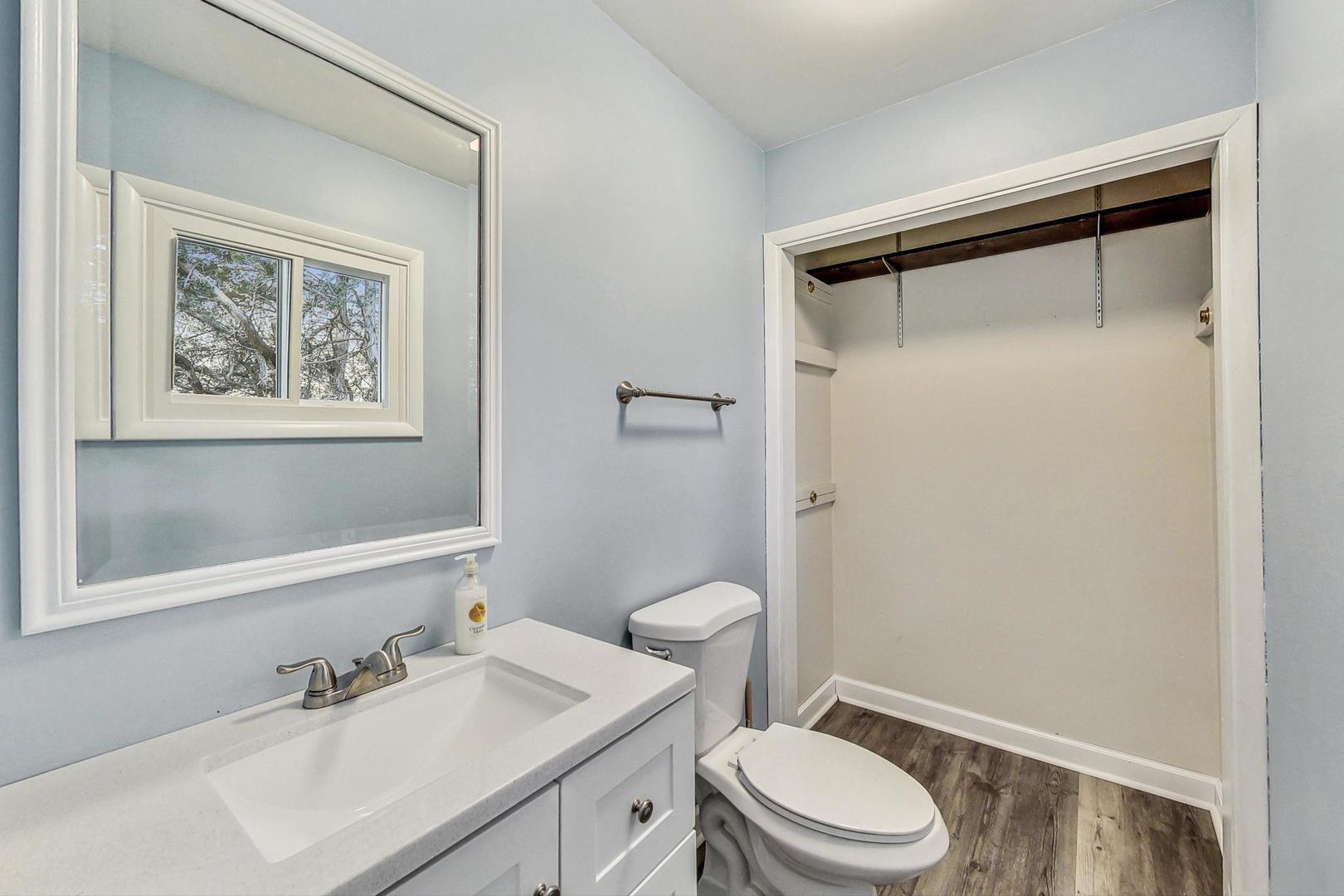 10S462 Ruth Drive Lemont, IL 60439 - Photo 12 of 24 a bathroom with a sink toilet and vanity