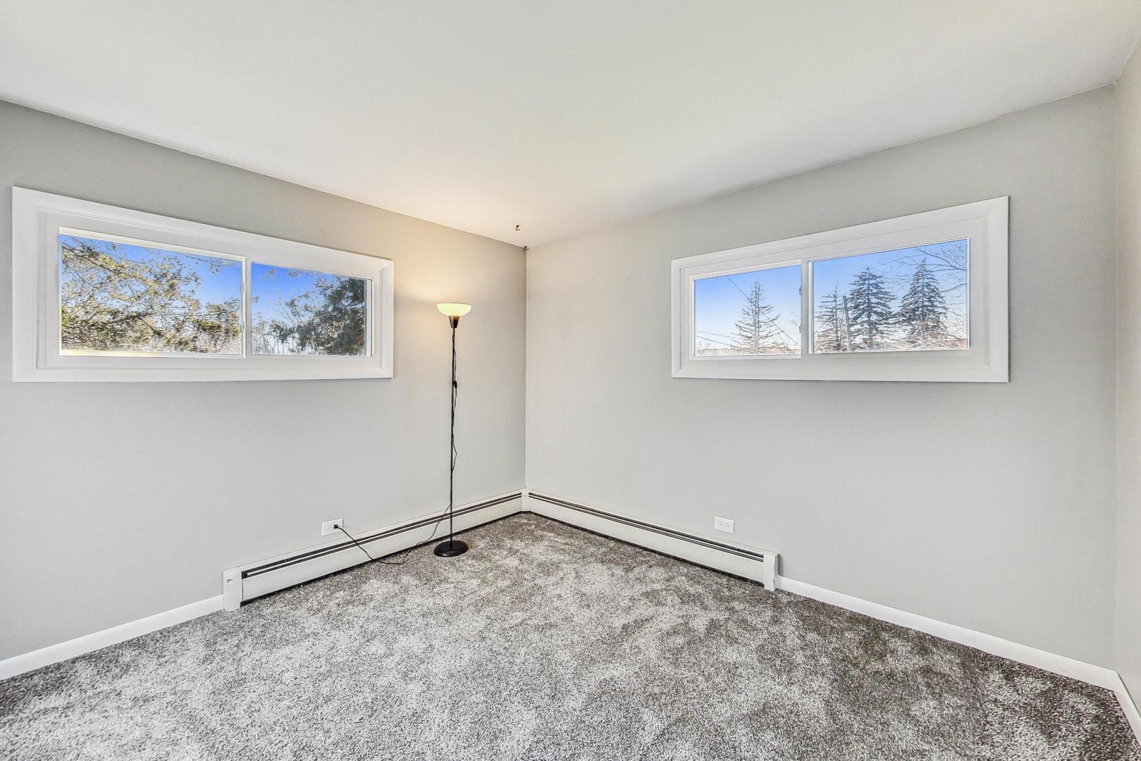 10S462 Ruth Drive Lemont, IL 60439 - Photo 13 of 24 a view of an empty room with a painting on the wall