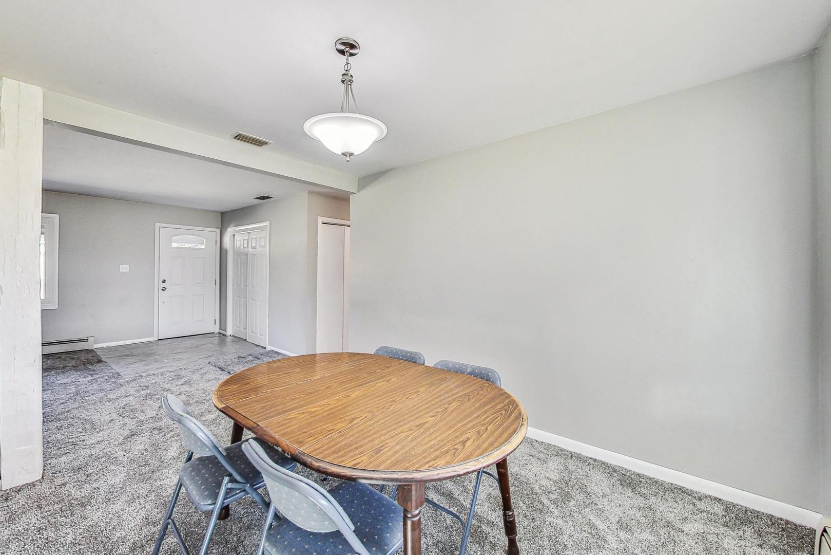 10S462 Ruth Drive Lemont, IL 60439 - Photo 6 of 24 a view of a room with a table and chairs