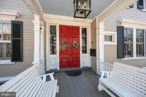 a living room with furniture a fireplace and a large window