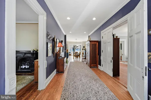 a living room with furniture fireplace and a large window