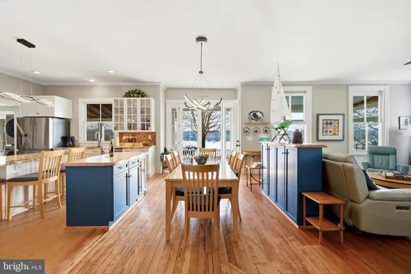 a bedroom with a bed and a large window with outer view