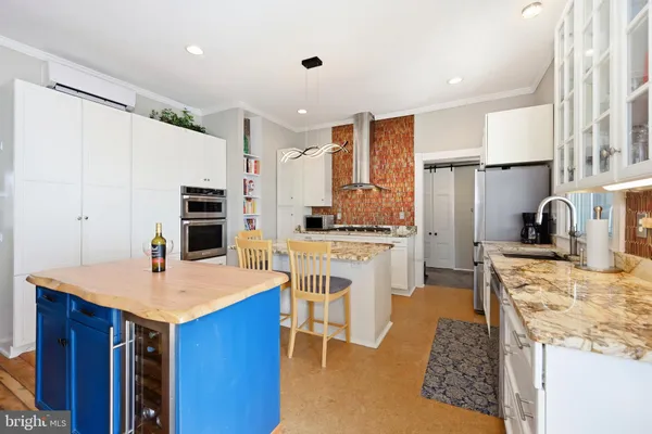 a work room with furniture and wooden floor