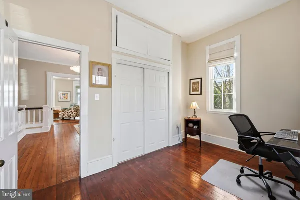 a view of an empty room with a fireplace