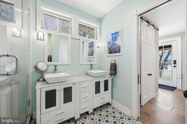 a living room with fireplace furniture and a window