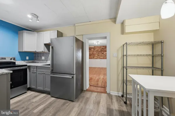 a bathroom with a sink a mirror and a shower