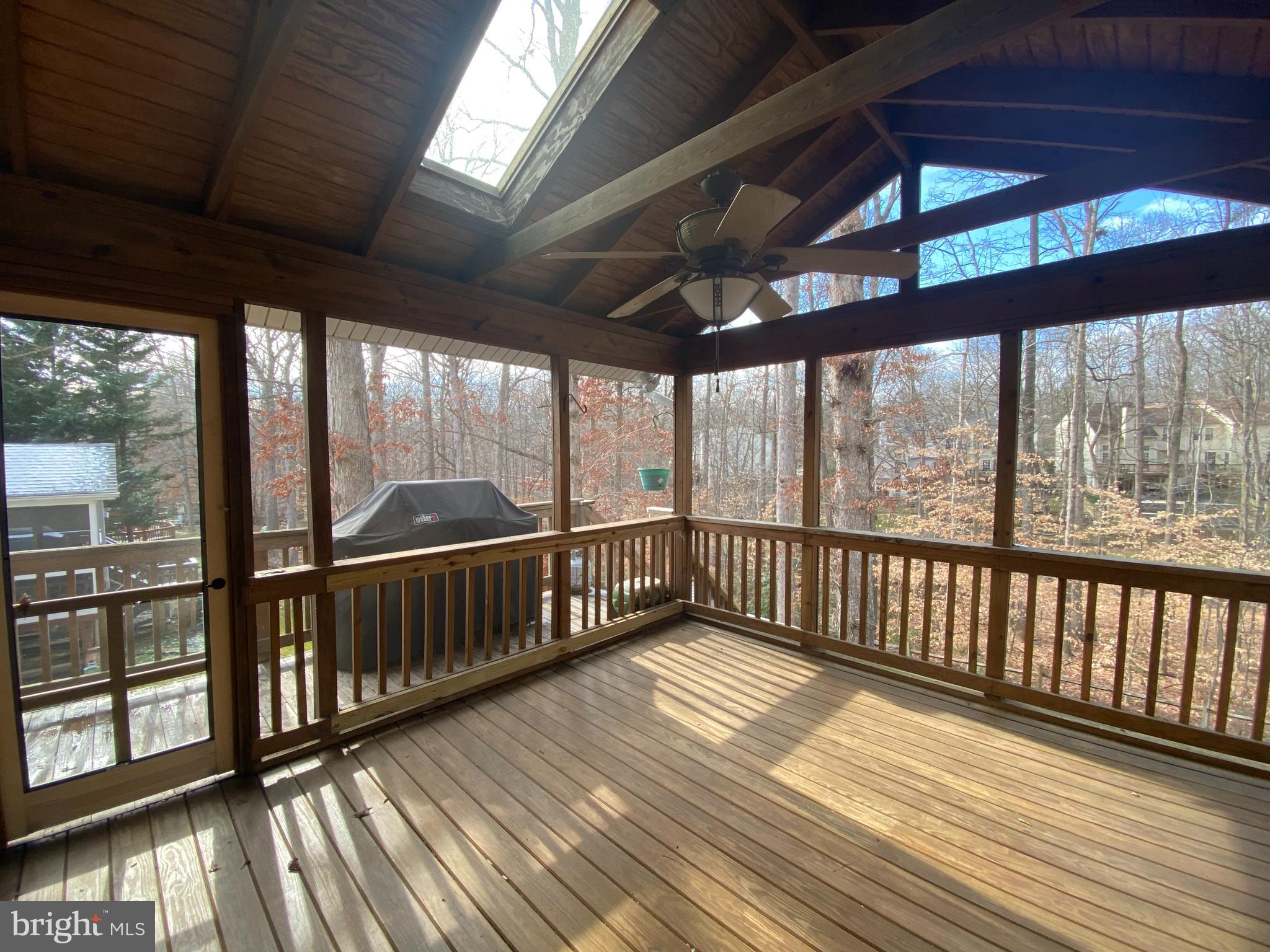 8012 Diving Cliff Lane Springfield, VA 22153 - Photo 26 of 29 Screen Porch with Walk-Down to Treed Yard