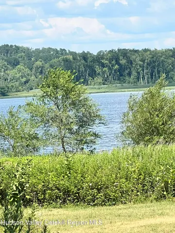 a view of a yard with an outdoor seating
