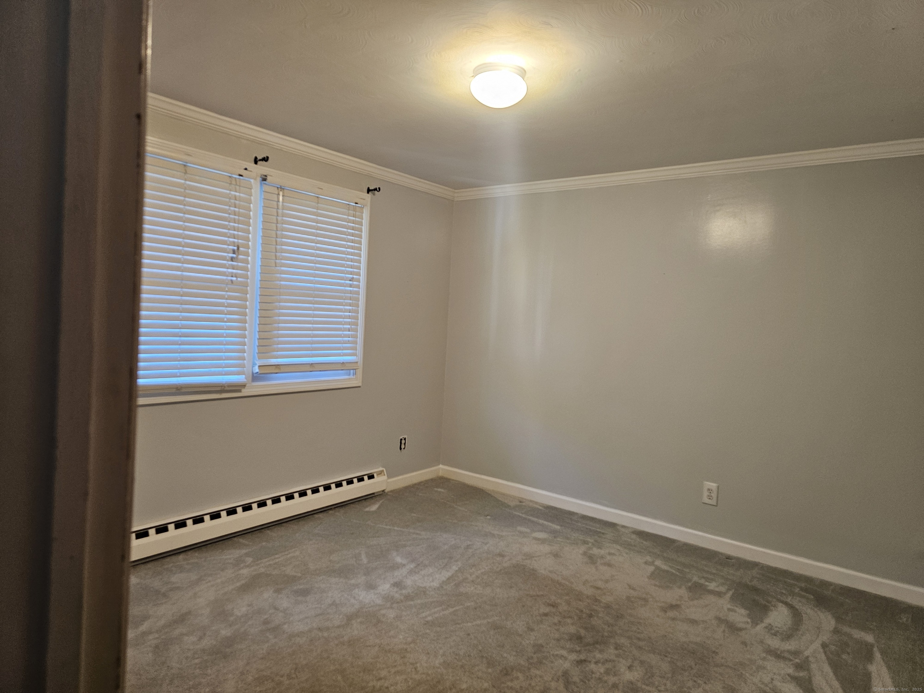 222 Crest Street Waterbury, CT 06708 - Photo 11 of 15 a view of an empty room with a window
