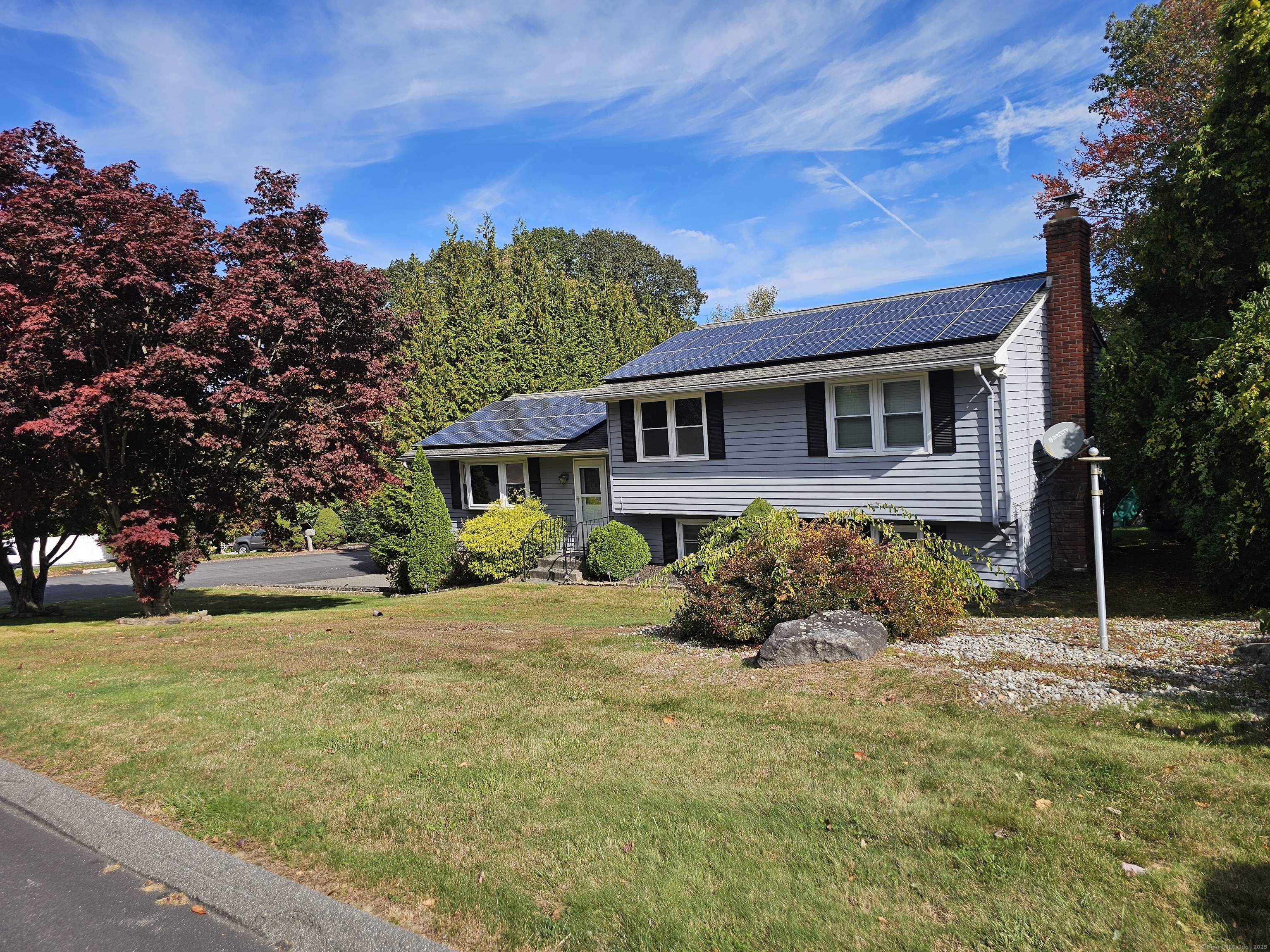 222 Crest Street Waterbury, CT 06708 - Photo 2 of 15 a front view of a house with a yard