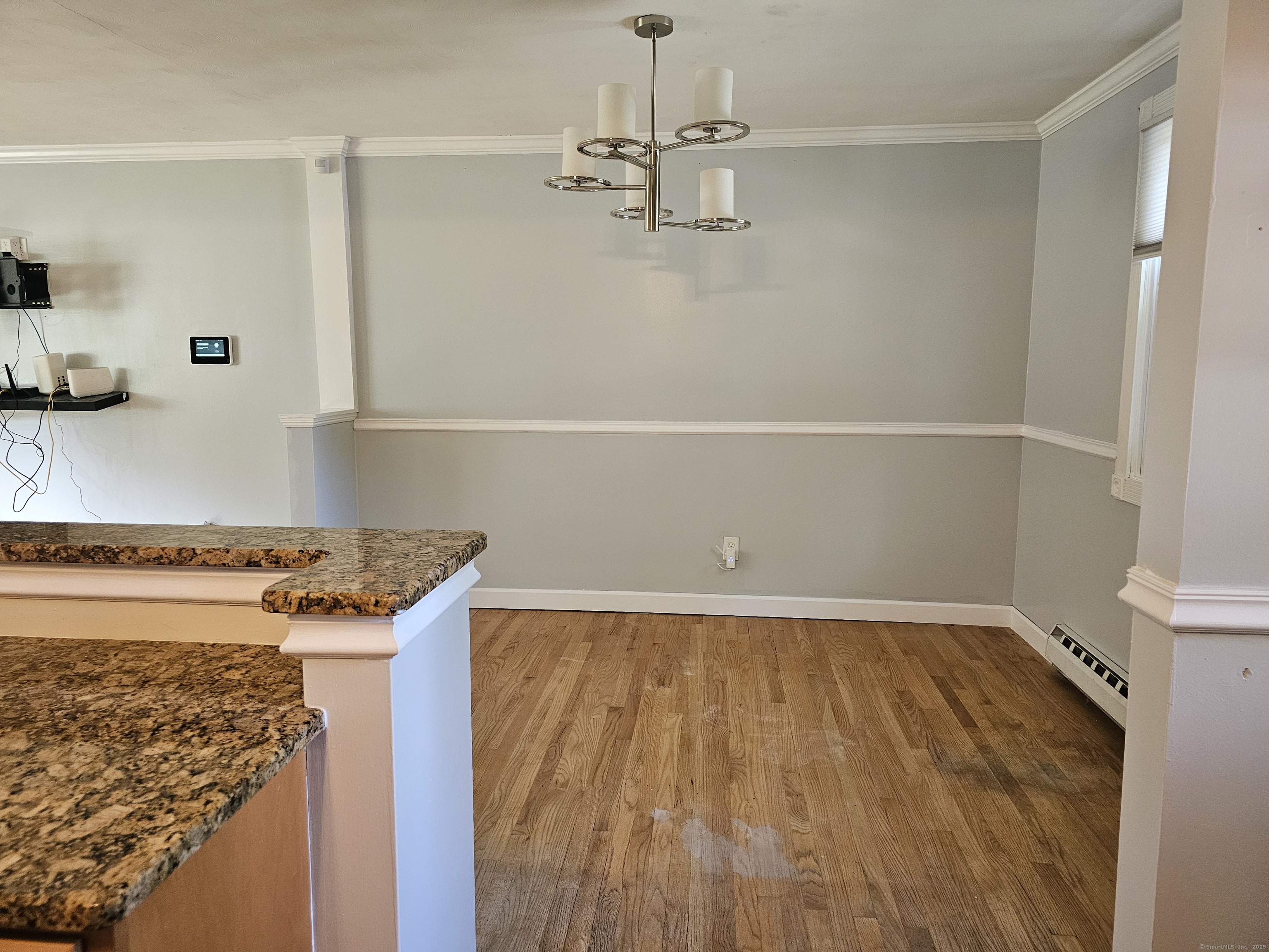 222 Crest Street Waterbury, CT 06708 - Photo 4 of 15 a view of a storage and utility room with wooden floor
