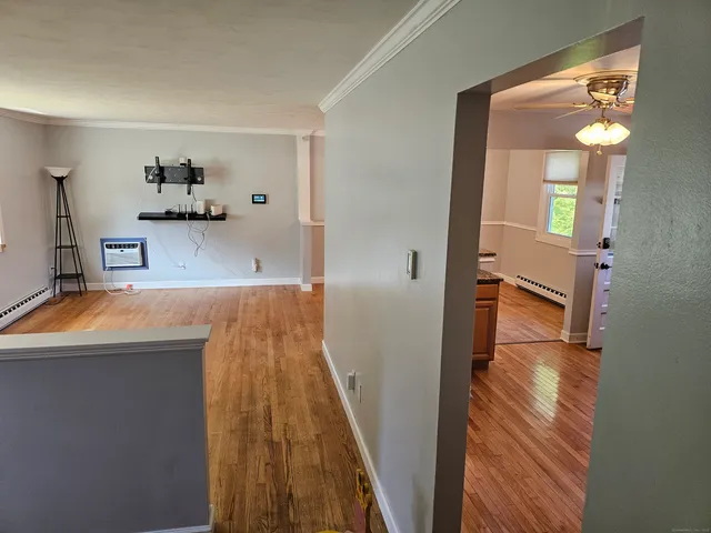a view of a kitchen from the hallway