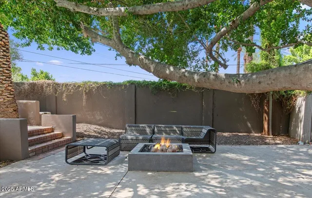 a view of a backyard with a patio