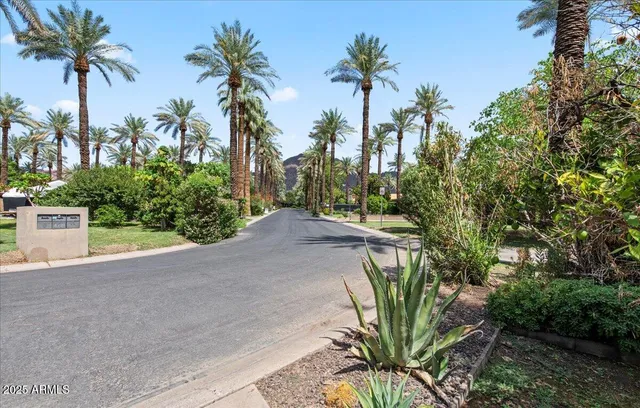 a view of a house with backyard sitting area and garden
