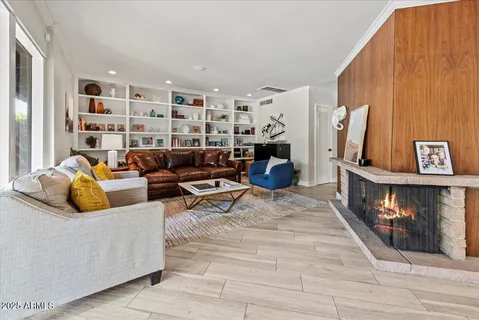 a living room with furniture and a fireplace