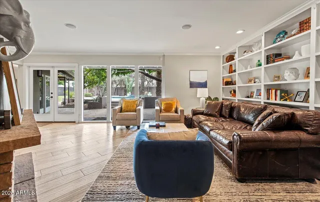 a living room with furniture or couch and a large window