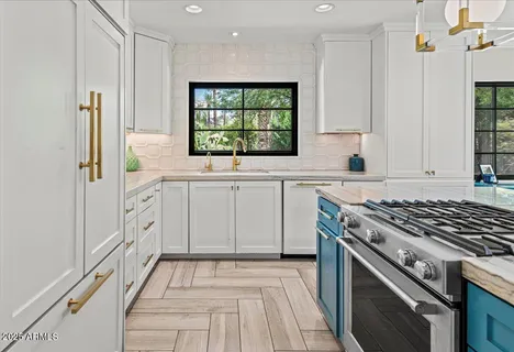 a kitchen with a stove and a white refrigerator