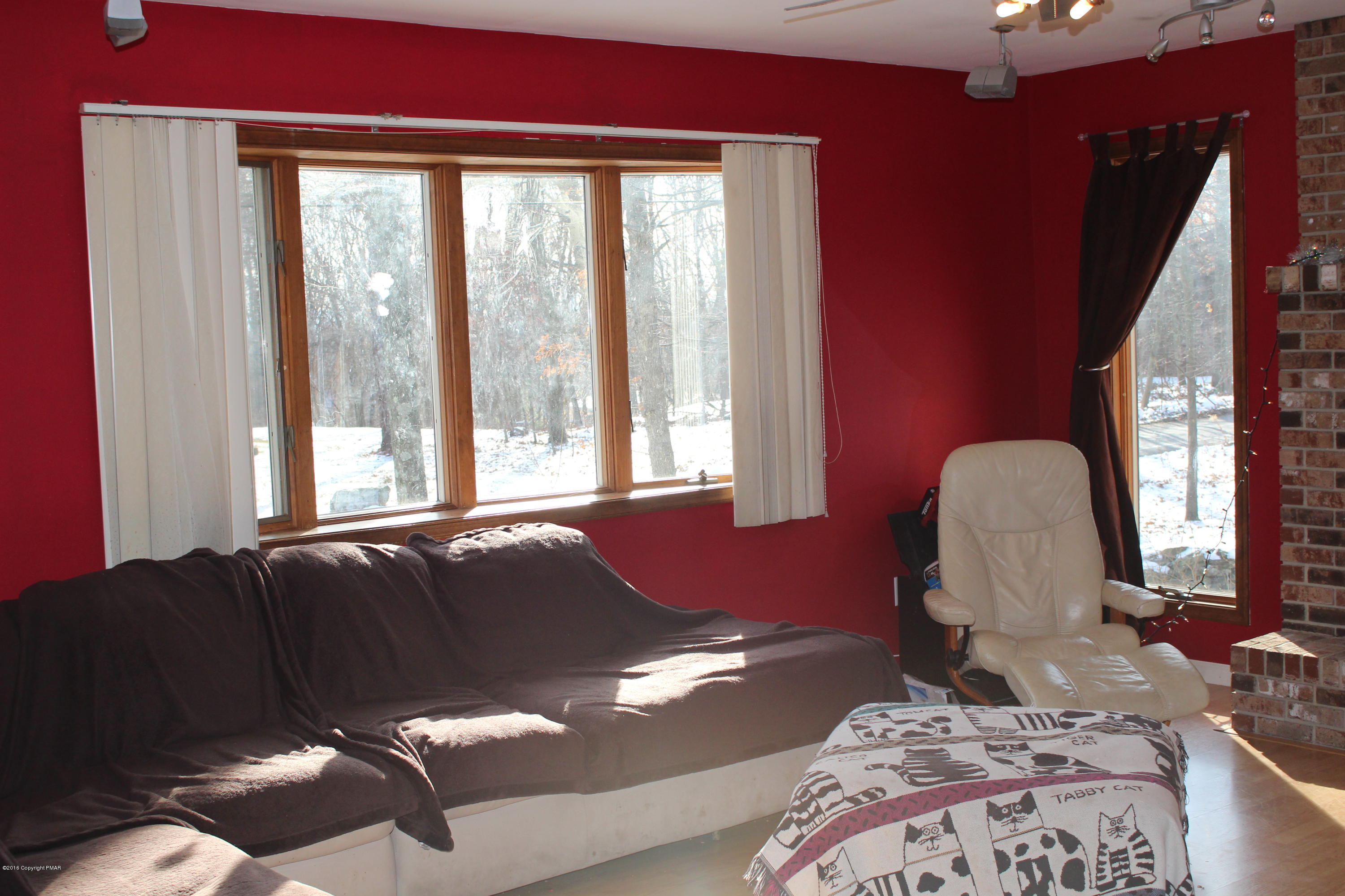 116 Mikes Road Bartonsville, PA 18321 - Photo 9 of 21 a bed sitting in a bedroom next to a window with lamp