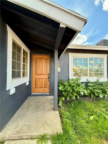 a view of a backyard of the house