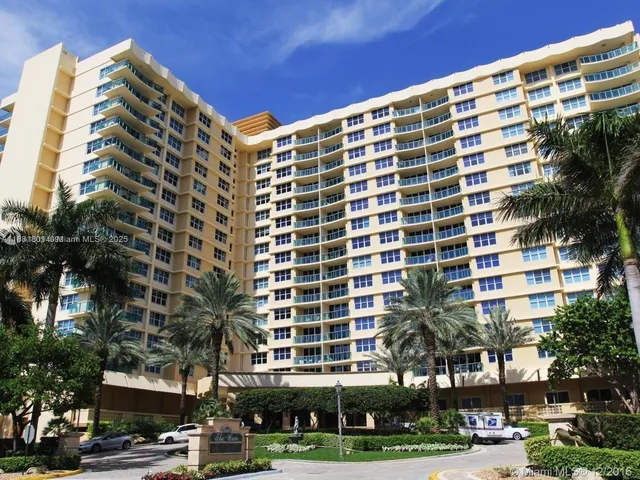 a front view of a building with a yard