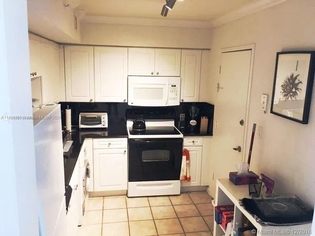 a kitchen with a stove and a microwave