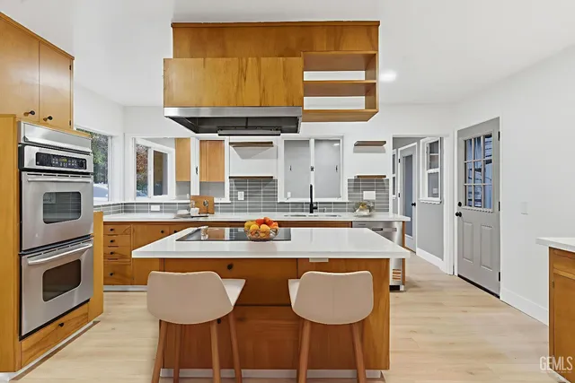 a kitchen with a counter space and appliances