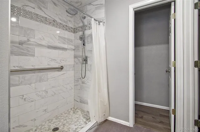 an empty room with windows and closet