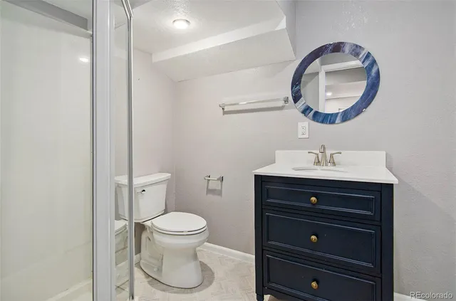 a view of a house with wooden fence