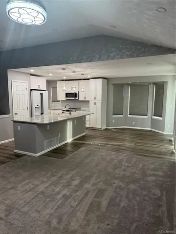 a view of a kitchen with a sink