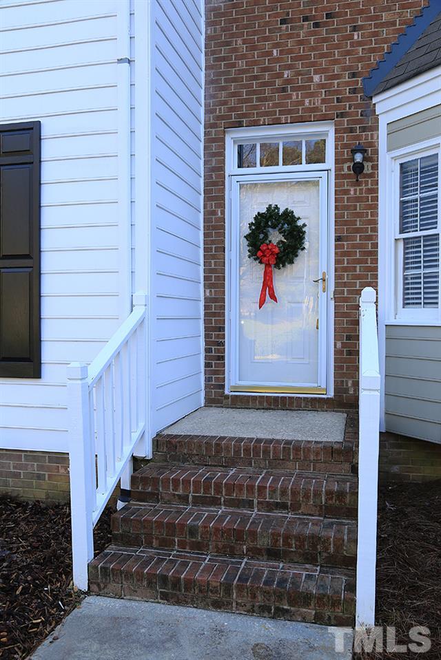 122 Skylark Way Raleigh, NC 27615 - Photo 2 of 30 a front view of a house with a yard