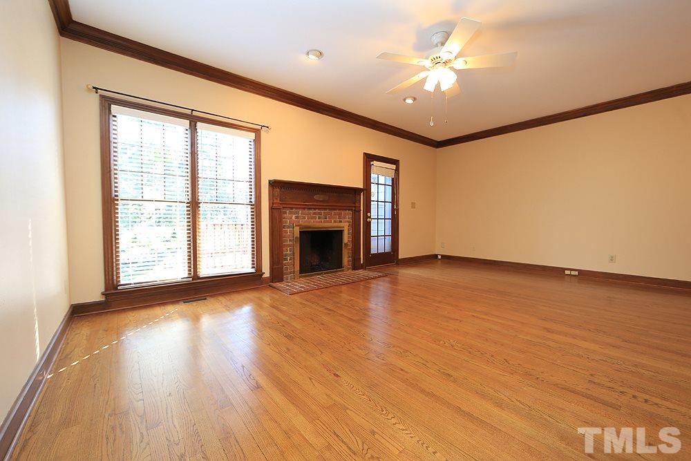 122 Skylark Way Raleigh, NC 27615 - Photo 12 of 30 a view of an empty room with window and wooden floor