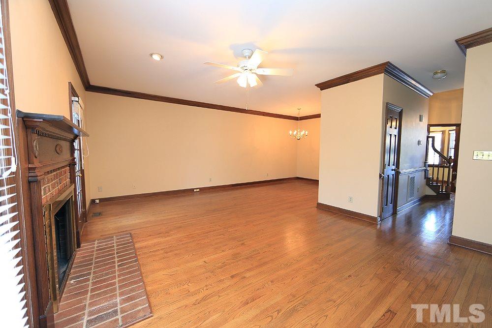122 Skylark Way Raleigh, NC 27615 - Photo 14 of 30 a view of a livingroom with wooden floor and a ceiling fan